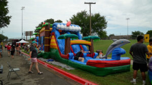 Fort Hood families enjoy games, inflatables, and activities during the Rick Herrema Foundation’s Summer Fun Fest July 19 at Abrams Physical Fitness Center. The event focused on building community and connection. (U.S. Army photo by Eric Franklin, Fort Hood Public Affairs)