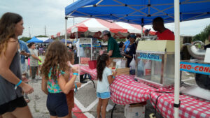 Children wait in line for snow cones during the Rick Herrema Foundation’s Summer Fun Fest, hosted July 19 outside Abrams Physical Fitness Center at Fort Hood, Texas. (U.S. Army photo by Eric Franklin, Fort Hood Public Affairs)