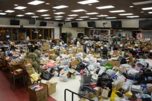 Volunteers fold, sort and organize donations